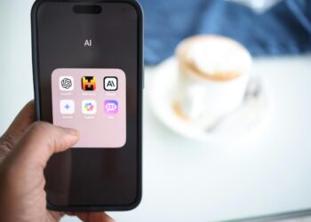 a person holding a cell phone in their hand